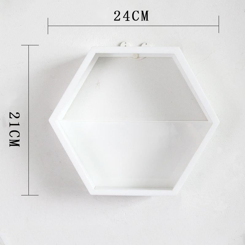 Close-up of acrylic geometric wall decor reflecting soft home lighting