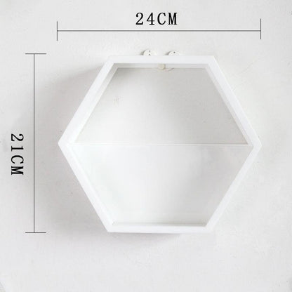 Close-up of acrylic geometric wall decor reflecting soft home lighting