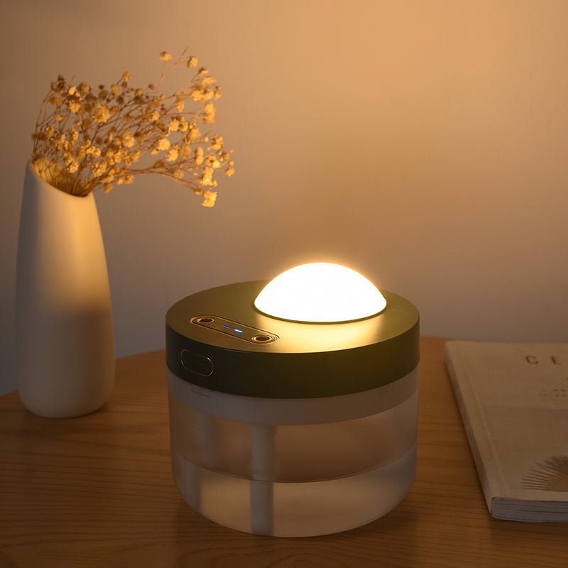 Mist humidifier placed beside a laptop creating a calming workspace atmosphere