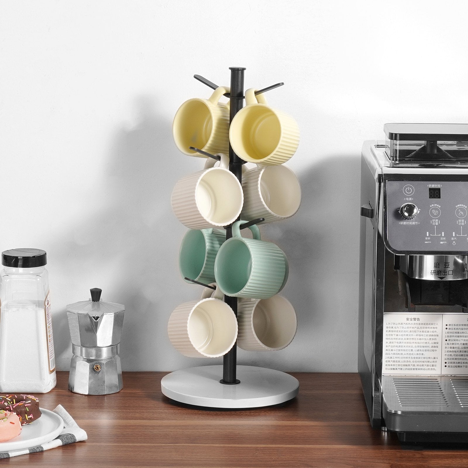 Keep your favorite mugs beautifully displayed and within reach with the Marble Base Mug Tree Holder. Designed with a sleek matte black finish and a luxurious real marble base, this stand blends modern style with everyday functionality — a perfect addition to any kitchen, coffee nook, or office break area.

⸻

✨ Key Features
	•	🏛️ Premium Marble Base: The solid marble base adds a touch of elegance and ensures superior stability — no tipping or wobbling.
	•	☕ Holds Up to 6 Mugs: Sturdy branches provide secur